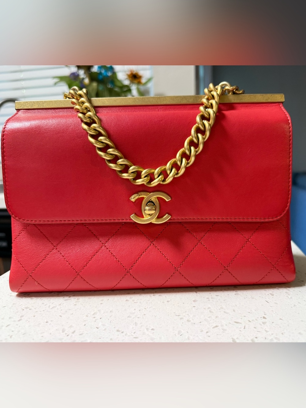 CHANEL Red Quilted Shoulder Bag with Gold Chain and CC Lock